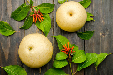 Asian pear on wooden background