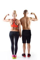 Athletic middle-age man and woman posing in studio