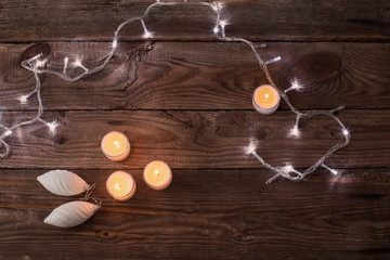 Christmas lights on a wooden background with copy space