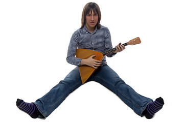 Playing brunette man on balalaika