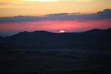 sunset between mointains in cappadocia