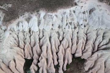 White rocks and valley with organic structure in cappadocia