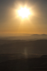 Golden sun over mointains and rocks in cappadocia