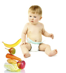 Cute baby boy with fruits and vegetables for feeding isolated on white