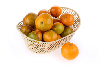 orange fruit in basket, isolated on white background