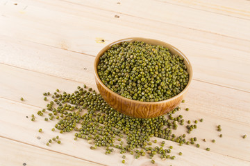 green beans on wood background
