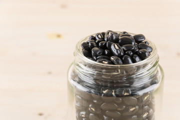 black beans on wood background
