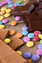 Color sweets between biscuits and chocolate
