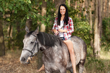 Fototapeta premium Young woman with a horse