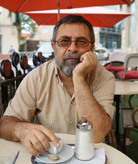 Senior man drinking cup of coffee