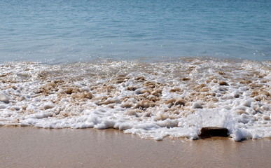 water, stones and sand in the beach
