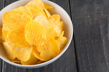 potato chips on wood background