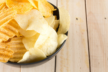 potato chips on wood background