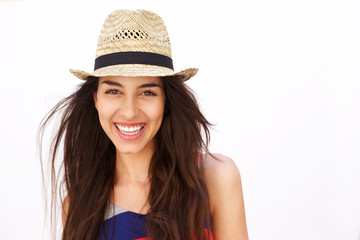 Close up portrait of an hispanic girl smiling with hat