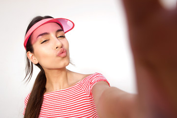 Fototapeta premium Cute girl taking selfie with cap