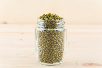 green beans on wood background
