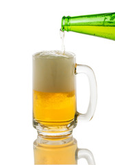 pouring beer to glass isolated on white