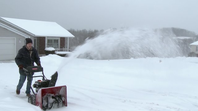4K Man Uses Snowblower 3981