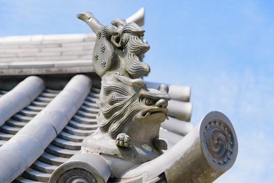 traditional japanese steel lion statue on the roof