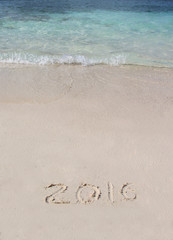 Handwriting inscription 2016 on the beach