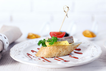 Tasty canape on wooden table, close up