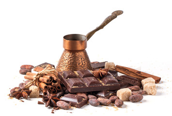 Copper cezve with dark chocolate and cocoa beans