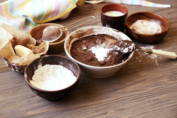 Preparing dough for chocolate pie on table close up