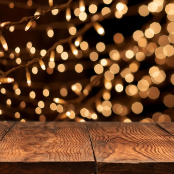 wooden table with yellow bokeh on background