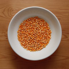 White Bowl with Corn Sweet on Wooden Desk