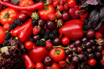 Red vegetables and berries background