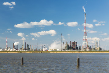 Fototapeta premium Antwerp Harbor Refinery And Flare Stack