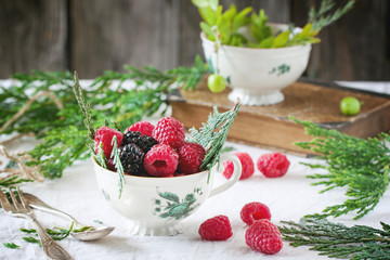 Cup of raspberries and blackberries
