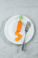 Plale with sliced carrot