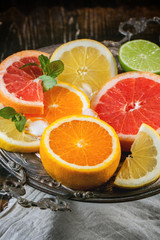 Fototapeta na wymiar Set of sliced citrus fruits