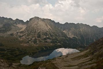 Naklejka na ściany i meble Wielki Staw Polski lake with Krzyzne peak reflected on water ground from Szpiglasowa Przelecz in Tatry mountains