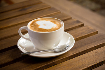 Coffee cup in garden coffee shop - vintage style effect picture