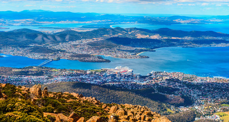 Aerial panoramic view of Hobart City and its vicinity from the Mount Wellington peak. Tasmanian Island, Australia. - obrazy, fototapety, plakaty