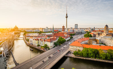 Berlin skyline with TV tower and Spree river at sunset, Germany
