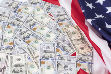 American dollars bills with flag background