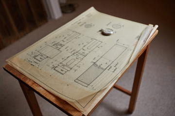 Old technical plan with pen on old table - 90762595