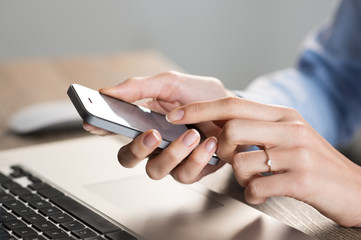 Fototapeta premium Typing a message on mobile phone
