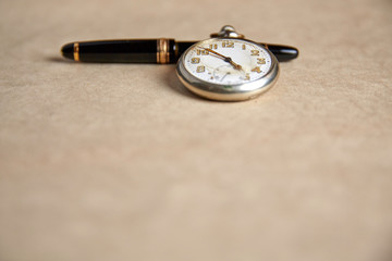 Old pocket watch on old paper