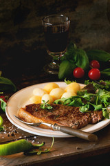 Grilled steak with potatoes