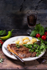 Grilled steak with potatoes