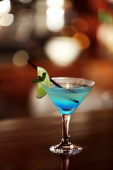 Cocktail on bar counter on bar background