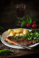Grilled steak with potatoes