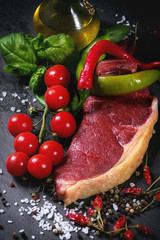 Raw steak with vegetables