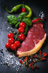 Raw steak with vegetables