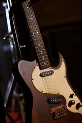 Fototapeta na wymiar Electric guitar close-up, on dark background