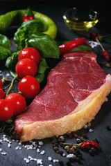 Raw steak with vegetables